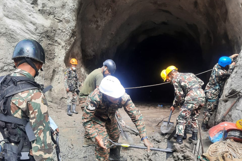 Rescue teams struggle to reach workers trapped in underground powerhouses