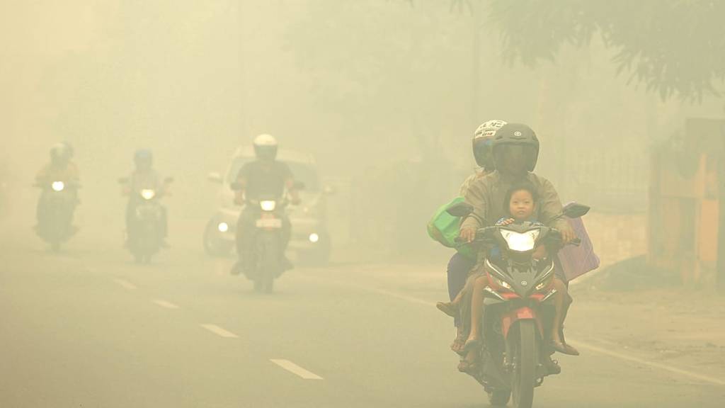 Indonesia’s skies turn apocalyptic orange as smoke blankets Singapore